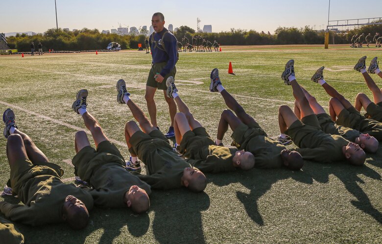 Recruits of Mike Company, 3rd Recruit Training Battalion, conduct hip raises during the bases event at Marine Corps Recruit Depot San Diego, Feb. 2. The first part of the event lasted for an hour before the recruits and drill instructors tackled the circuit course. Annually, more than 17,000 males recruited from the Western Recruiting Region are trained at MCRD San Diego. Mike Company is scheduled to graduate April 15.