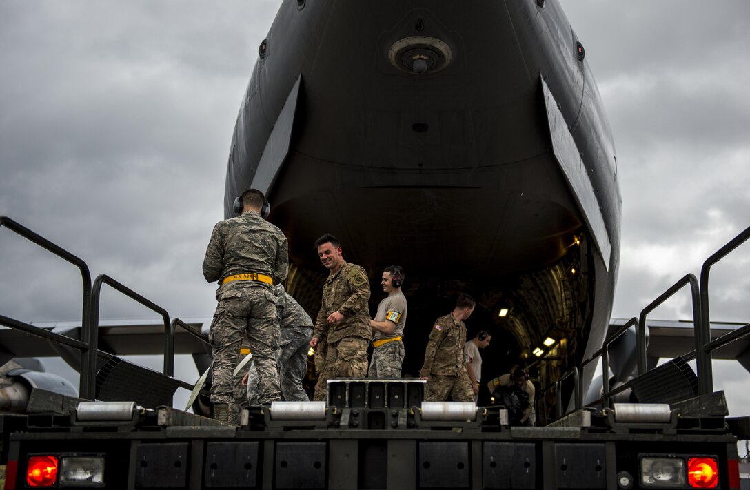 Air Force airmen and Army soldiers load container delivery system bundles onto a C-17 Globemaster III aircraft on Pope Army Airfield, N.C., Feb. 3, 2016. Air Force photo by Staff Sgt. Marianique Santos