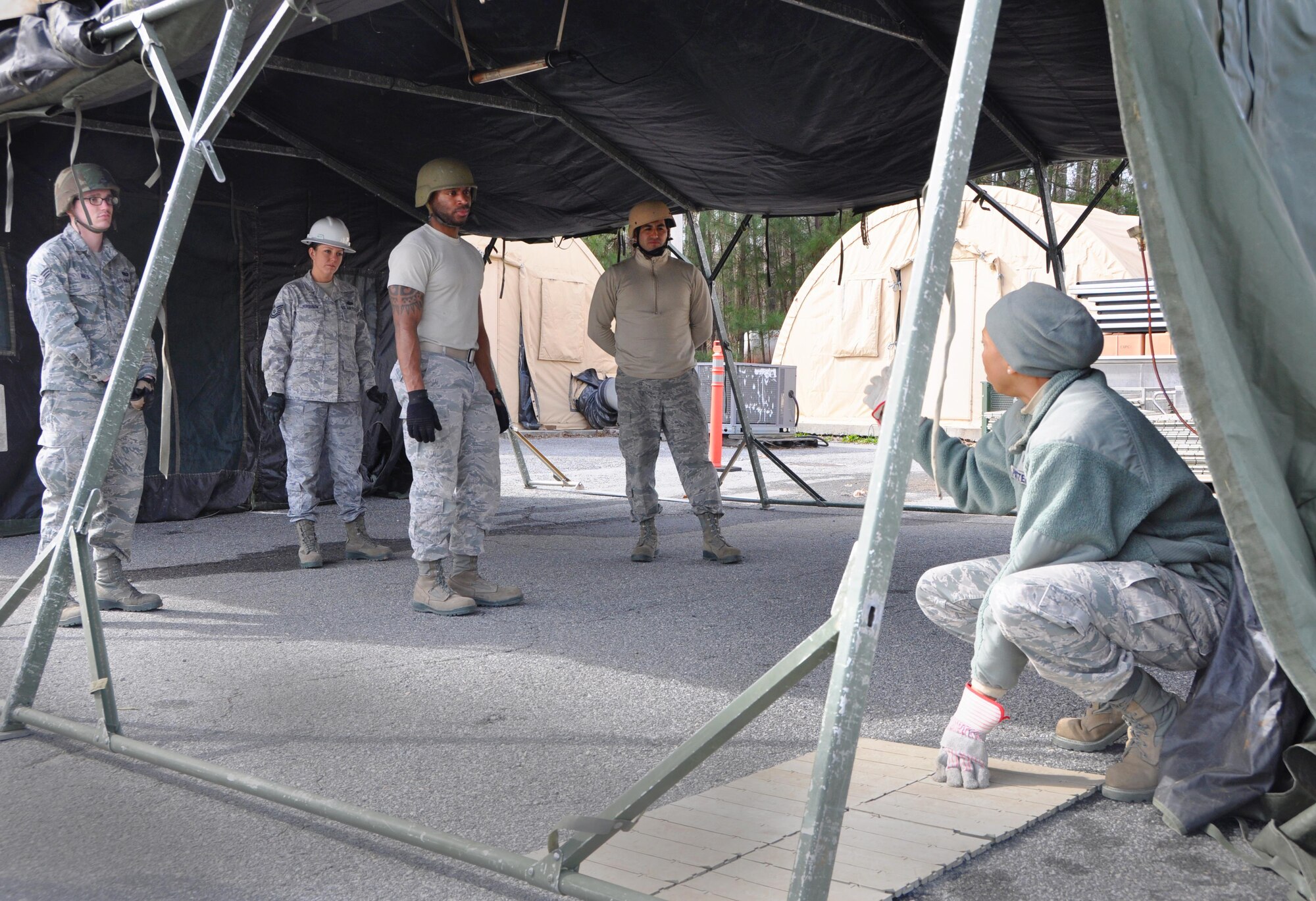 Technical Sgt. Latoya Patterson, 622nd Civil Engineer Group Force Support Silver Flag training instructor gave students hands-on, real-world demonstrations of tent structures and equipment in the FSSF field training facility Jan. 25, 2016 at Dobbins Air Reserve Base, Ga. Throughout the training week students spent time learning about the physical set up for lodging and food service tent structures. (Photo by U.S. Air Force Senior Airman Lauren Douglas)