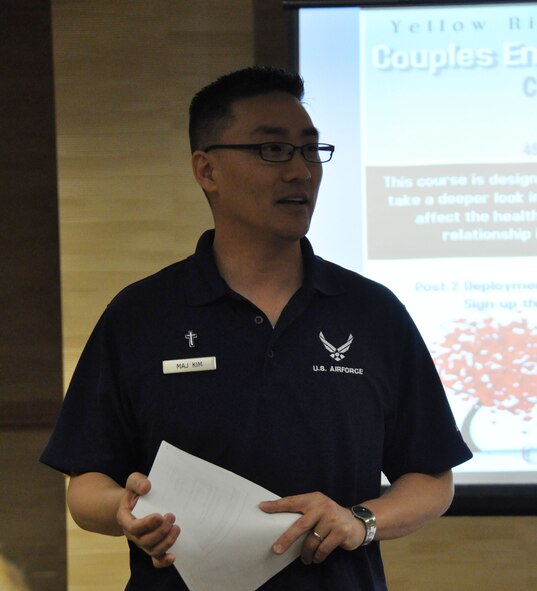 Chaplain (Maj.) Joshua Kim welcomes 17 couples to the inaugural Couples Enrichment Program class Jan. 30, 2015, during a Yellow Ribbon Reintegration Program training weekend in Denver. Kim, a reservist with the 459th Air Refueling Wing at Joint Base Andrews, Maryland, adapted the curriculum from a civilian course to help Airmen and their partners take a deeper look into important dynamics that affect the health of relationships. (U.S. Air Force photo by Master Sgt. Megan Crusher)