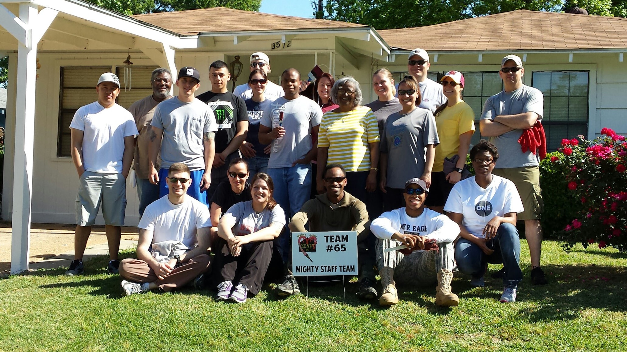Volunteers pose for a group photo during a home restoration project in Shreveport, La., May 5, 2014. The First Four Airman’s Association provided notices of upcoming fundraisers to Barksdale Air Force Base Airmen in ranks E-1 to E-4 who were members of the F4AA. (Courtesy photo)