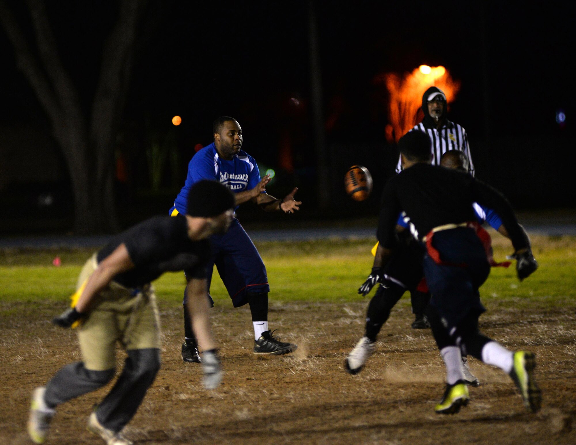 Brandon Davidson, 2nd Maintenance Squadron quarterback, receives the snap during a flag football playoff semifinals game at Barksdale Air Force Base, La., Jan. 27, 2016. The 2nd MXS team upset the top ranked 2nd Force Support Squadron team 7-6 to advance to the championship, but fell in the end to champions Air Force Global Strike Command/8th Air Force. (U.S. Air Force photo/Airman 1st Class Curt Beach)