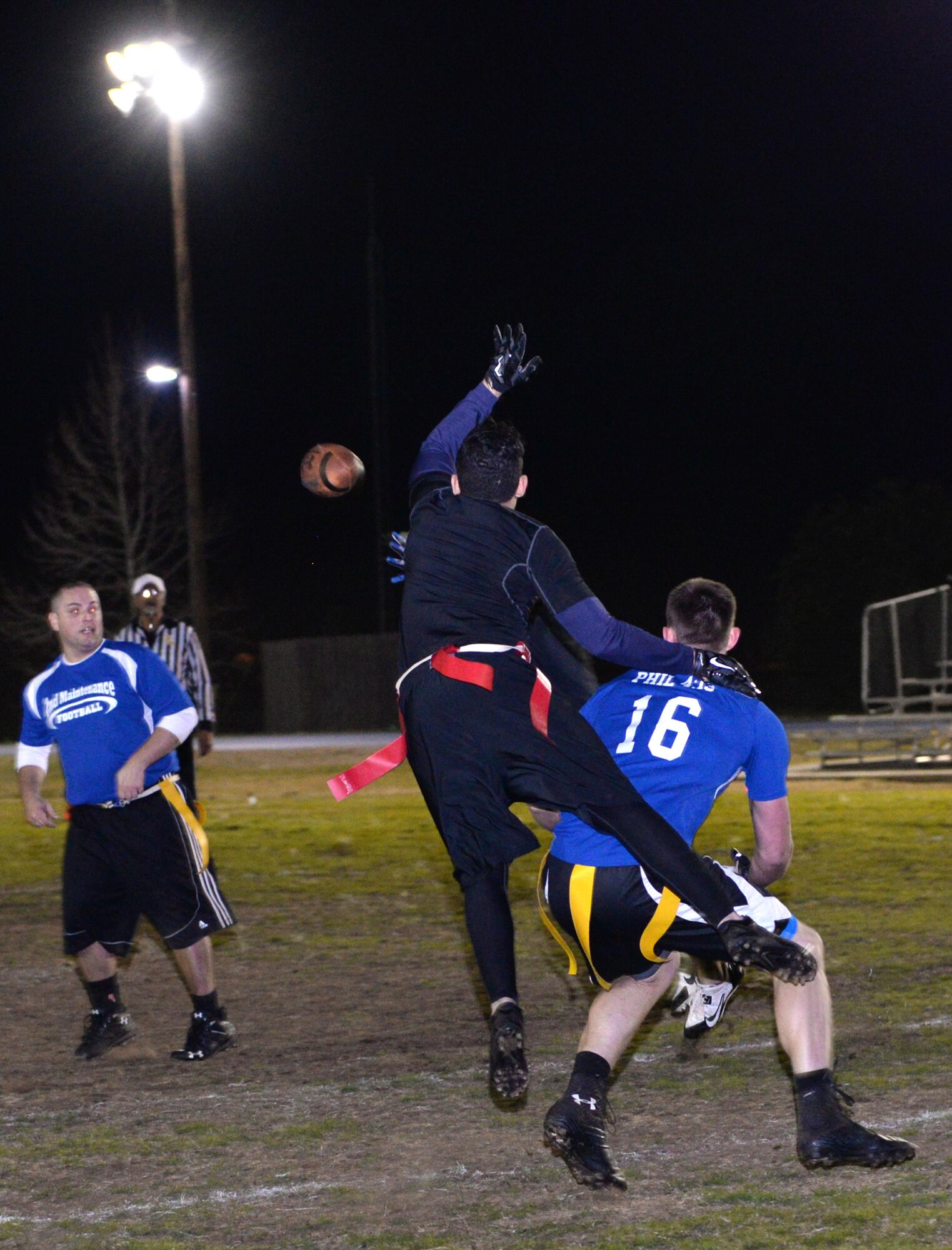 A receiver and defender battle for position during the flag football championship game at Barksdale Air Force Base, La., Jan. 28, 2016. The Air Force Global Strike Command/8th Air Force team defeated the 2nd Maintenance Squadron team 21-19 to claim the trophy. (U.S. Air Force photo/Airman 1st Class Curt Beach)