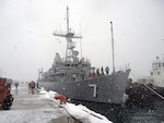 OTARU, Japan (Feb. 4, 2016) - Snow falls as the minesweeper USS Patriot (MCM 7) pulls into Otaru for a port visit. Patriot is forward deployed to Sasebo, Japan, supporting security and stability in the Indo-Asia-Pacific region as part of U.S. 7th Fleet's Amphibious Ready Group. 