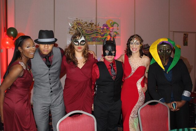 Marines pose in their costumes at the Headquarters and Services Mardi Gras Masquerade Ball at The Clubs at Quantico Jan. 29.