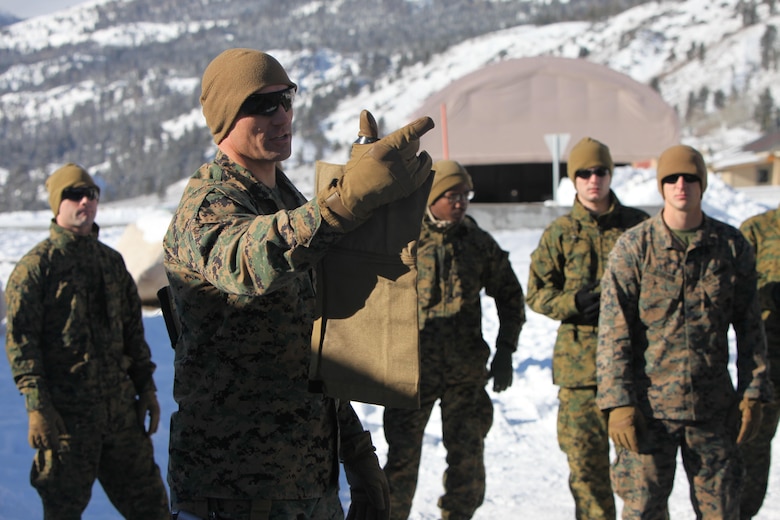 Master Sgt. Donald Johnson instructs Marines with 2nd Low Altitude Air Defense Battalion on properly utilizing cold weather gear during cold weather training at Marine Corps Mountain Warfare Training Center, Calif., Jan. 21, 2016. The cold weather training done in the Sierra Mountains is a warm-up to Exercise Cold Response 1-16 in Norway. Nearly 80 Marines with 2nd LAAD Bn. participated in the two-weeklong exercise that taught basic mobility in snow, defensive and offensive tactics as well as basic cold weather and high altitude conditions training. Johnson is the operations chief with 2nd LAAD Bn.