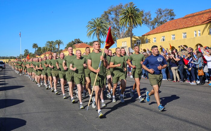 Marines of Lima Company, 3rd Recruit Training Battalion, run in formation as their drill instructors call cadence during a motivation run at Marine Corps Recruit Depot San Diego, Feb. 4. After the Marines graduate recruit training, they receive 10 days of leave before reporting to the School of Infantry for Marine Combat Training. Annually, more than 17,000 males recruited from the Western Recruiting Region are trained at MCRD San Diego. Lima Company is scheduled to graduate Feb. 5.