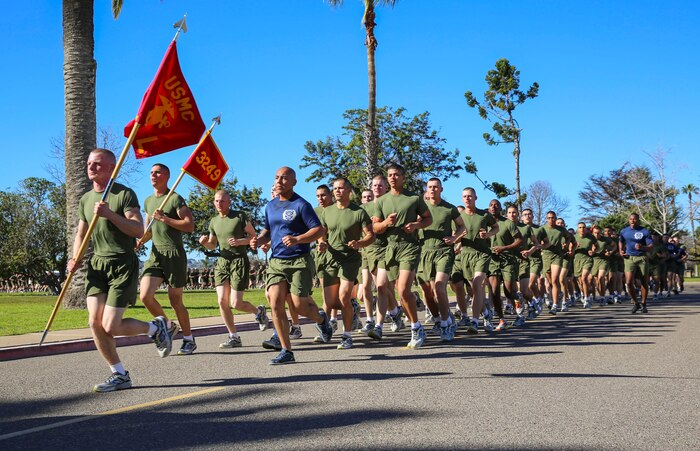 Marines of Lima Company, 3rd Recruit Training Battalion, run in formation as their drill instructors call cadence during a motivation run at Marine Corps Recruit Depot San Diego, Feb. 4. After the Marines graduate recruit training, receive granted 10 days of leave before reporting to the School of Infantry for Marine Combat Training. Annually, more than 17,000 males recruited from the Western Recruiting Region are trained at MCRD San Diego. Lima Company is scheduled to graduate Feb. 5.