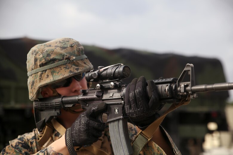 Cpl. Devin K. Maddox-White, a fire team leader and motor vehicle operator with 2nd Transportation Support Battalion, aims his M4 Carbine service rifle at notional enemies during a tactical operations package with Battle Skills Training School, 2nd Marine Logistics Group, at Camp Lejeune, N.C., Feb. 3, 2016. The course is conducted to refresh Marines from non-infantry military occupational specialties on infantry-related skills and tactics in a five-week span. (U.S. Marine Corps photo by Cpl. Joey Mendez)