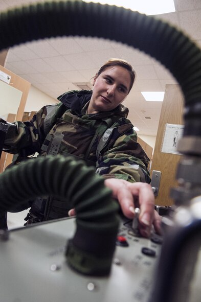 Staff Sgt. Patricia Johnson, 8th Operation Support Squadron aircrew flight equipment journeyman, tests the air pressure of an F-16 Fighting Falcon pilot’s G-suit during Beverly Pack 16-2 at Kunsan Air Base, Republic of Korea, Feb. 4, 2015. Though the exercise was planned for months, Airmen were not told when it would start, testing their readiness and ability to respond to a crisis at a moment's notice. (U.S. Air Force photo by Staff Sgt. Nick Wilson/Released)