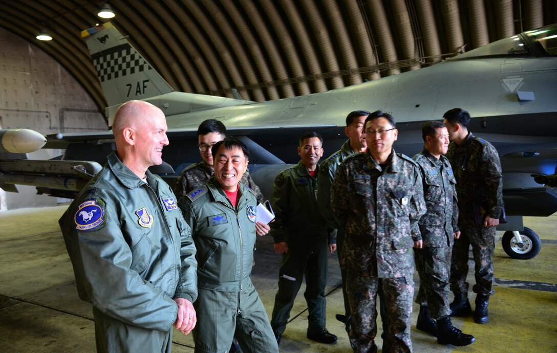 Col. Andrew Hanson, 51st Fighter Wing commander, escorts Maj. Gen. Choi, Geyn Young, Republic of Korea air force Air Mobility Reconnaissance Command commander, during his immersion tour at Osan Air Base, ROK, Feb. 1, 2016. Choi was briefed on the individual capabilities and missions of the F-16 Fighting Falcon, A-10 Thunderbolt II and U-2 Dragon Lady. (U.S. Air Force photo by Staff Sgt. Amber Grimm/Released)