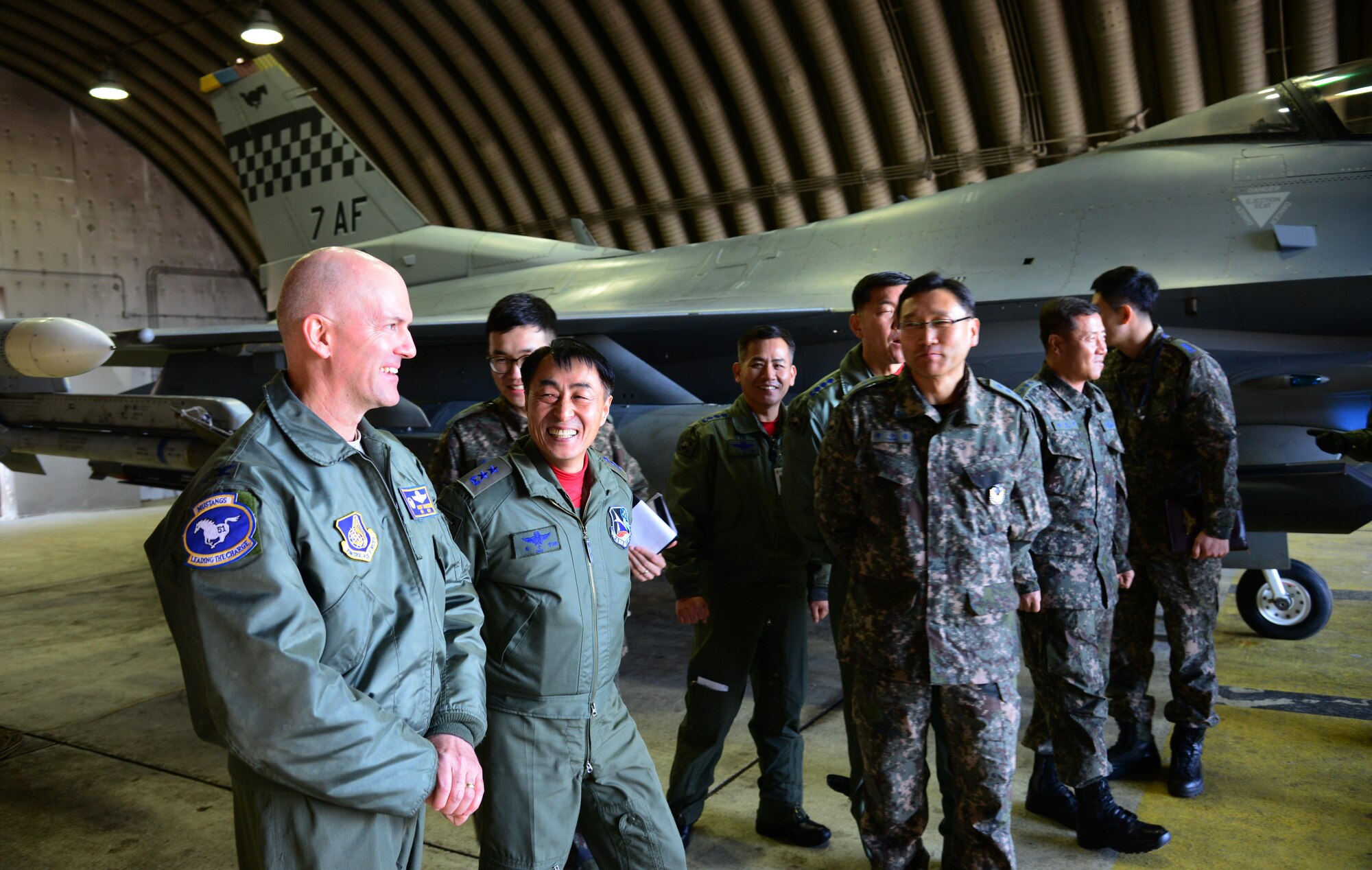 Col. Andrew Hanson, 51st Fighter Wing commander, escorts Maj. Gen. Choi, Geyn Young, Republic of Korea air force Air Mobility Reconnaissance Command commander, during his immersion tour at Osan Air Base, ROK, Feb. 1, 2016. Choi was briefed on the individual capabilities and missions of the F-16 Fighting Falcon, A-10 Thunderbolt II and U-2 Dragon Lady. (U.S. Air Force photo by Staff Sgt. Amber Grimm/Released)