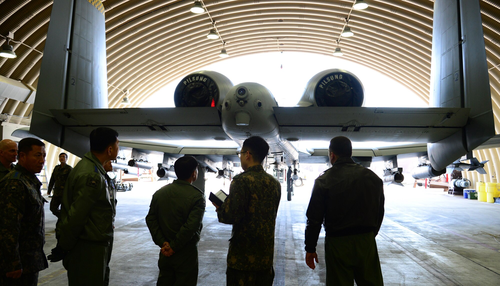 Maj. Craig Morash, 25th Fighter Squadron director of operations, briefs Maj. Gen. Choi, Geyn Young, Republic of Korea air force Air Mobility Reconnaissance Command commander, on A-10 Thunderbolt II capabilities during an immersion tour at Osan Air Base, ROK, Feb. 1, 2016. Choi toured the base to learn about the various assets the 51st Fighter Wing provides. (U.S. Air Force photo by Staff Sgt. Amber Grimm/Released)