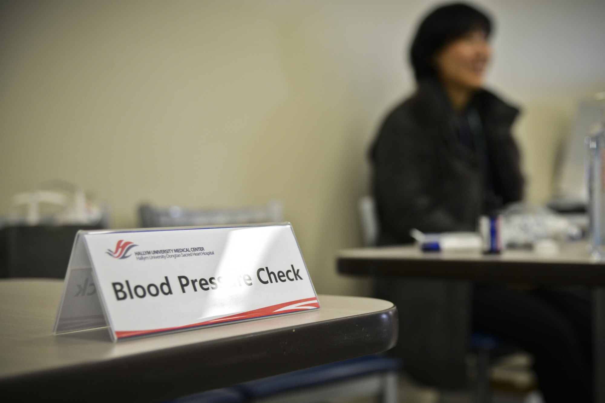 A blood pressure-check station awaits the next patient during the Retiree Appreciation Day in the Exchange at Osan Air Base, Republic of Korea, Feb. 4, 2016. One doctor and a team of nurses from the Hallym University Dongtan Sacred Heart Hospital were on hand in the Exchange to give free health screenings to retirees. (U.S. Air Force photo by Tech. Sgt. Travis Edwards/Released)