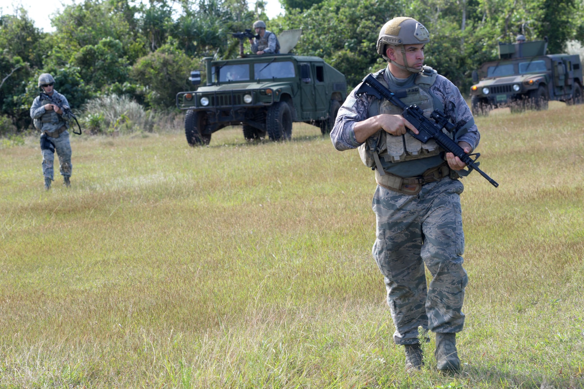 Staff Sgt. Robert Keefe, 736th Security Forces Squadron NCO in charge of training, performs an unexploded ordnance sweep Dec. 30, 2015, during a training exercise at Andersen Air Force Base, Guam.  On Oct. 16, 2015, Keefe graduated from the U.S. Army’s Ranger School. (U.S. Air Force photo/Senior Airman Joshua Smoot)