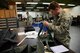 Staff Sgt. Ryan Malmquist, 51st Operations Support Squadron aircrew flight equipment specialist, repacks a pilot survival kit at the AFE main shop on Osan Air Base, Republic of Korea, Jan. 26, 2016. The main shop is responsible for maintaining all equipment installed in each aircrafts ejection seats. (U.S. Air Force photo by Staff Sgt. Amber Grimm/Released)
