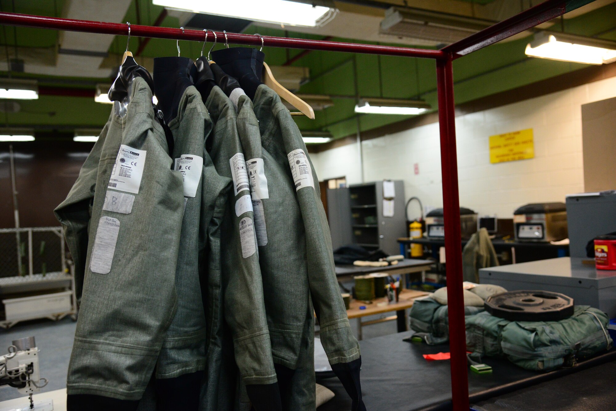 Anti-exposure suits await inspection in the main shop of the 51st Operations Support Squadron Aircrew Flight Equipment shop at Osan Air Base, Republic of Korea, Jan. 26, 2016. During the cold winter months, pilots are required to wear the suit in addition to their normal gear. In the event of an emergency ejection over water, the suit will insulate the pilot from the cold water increasing survival time before rescue. (U.S. Air Force photo by Staff Sgt. Amber Grimm/Released)