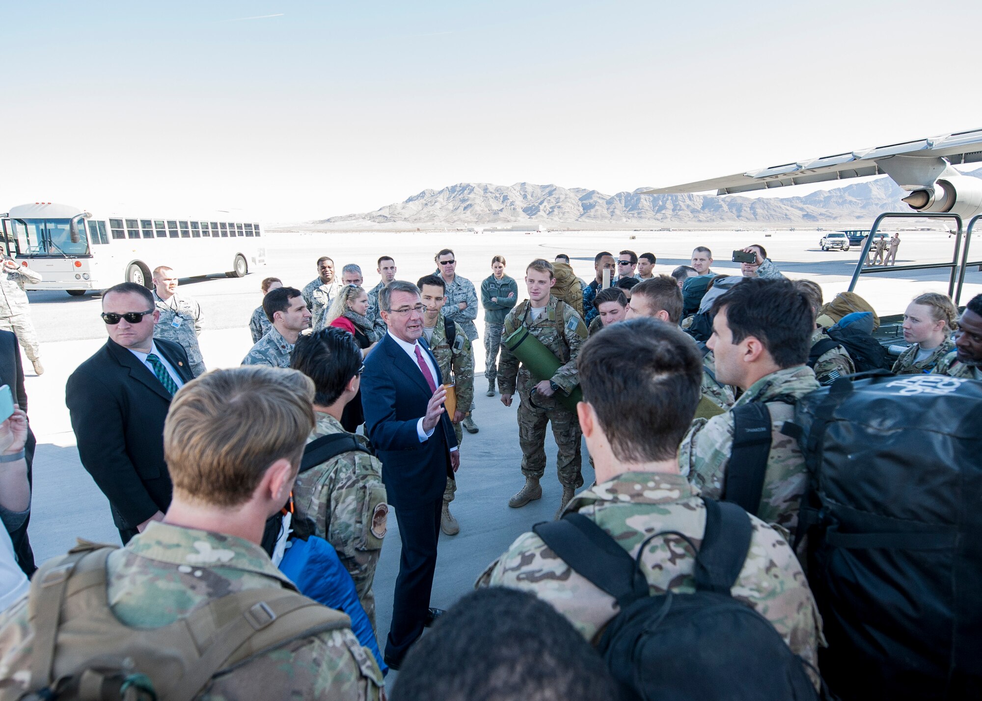 Defense Secretary Ash Carter speaks to Airmen returning from deployment at Nellis Air Force Base, Nev., Feb. 4, 2016. On his way to depart the base, Carter noticed a C-5 Galaxy unloading precious cargo -- the Airmen returning from deployment -- so he took a 20-minute detour to personally welcome home all of the returning Airmen. (U.S. Air Force photo by Staff Sgt. Siuta B. Ika)