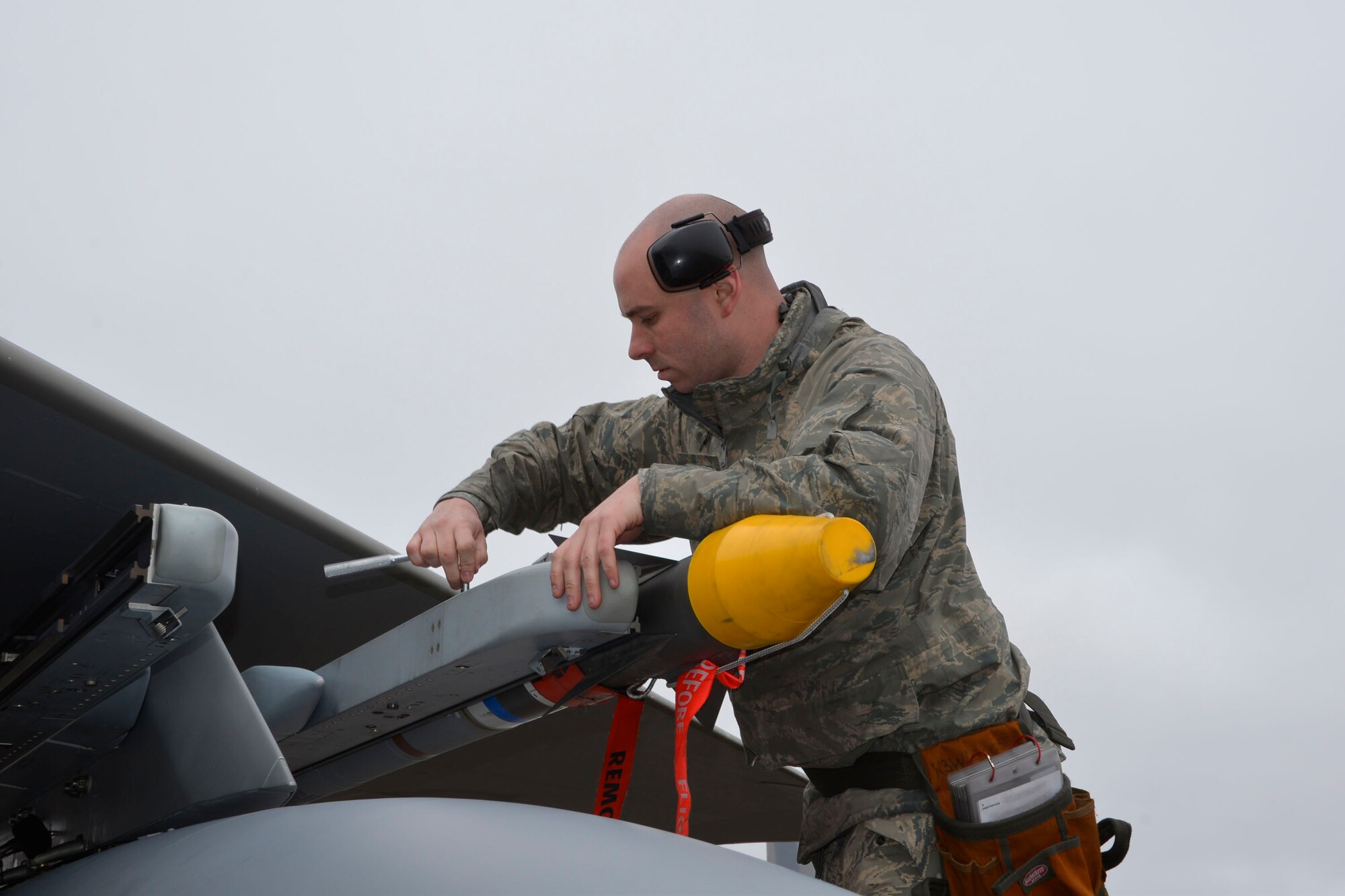 From the 142nd Fighter Wing, Portland, Oregon, Staff Sgt. Brian Boatman, 142nd Maintenance Group weapons loader, tightens a missile to the rail of an F-15 Eagle Jan. 28 during a deployment to Combat Archer, a two-week weapon systems evaluation program at Tyndall Air Force Base. During the program, participants load, fly and shoot live missiles and subsequently evaluate the entire process to validate whether the weapon performs according to established specifications. (Air Force Photo Released/Mary McHale)