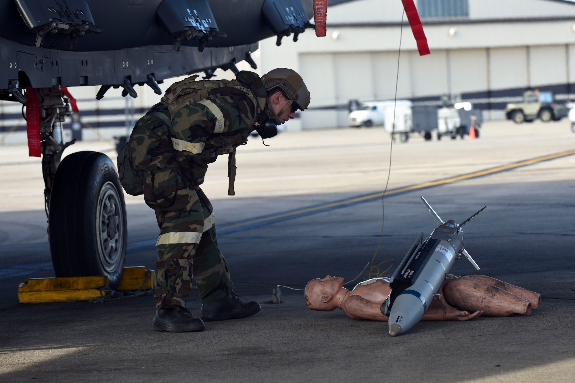 Staff Sgt. Derek Horn, 4th Civil Engineer Squadron explosive ordnance disposal technician, attempts to identify a simulated weapon during exercise Coronet Warrior 16-01, Feb. 1, 2016, at Seymour Johnson Air Force Base, North Carolina. After a simulated bomb was dropped, EOD members were called out to the flightline to determine how to safely remove the explosive and clear the scene. (U.S. Air Force photo/Airman Shawna L. Keyes)