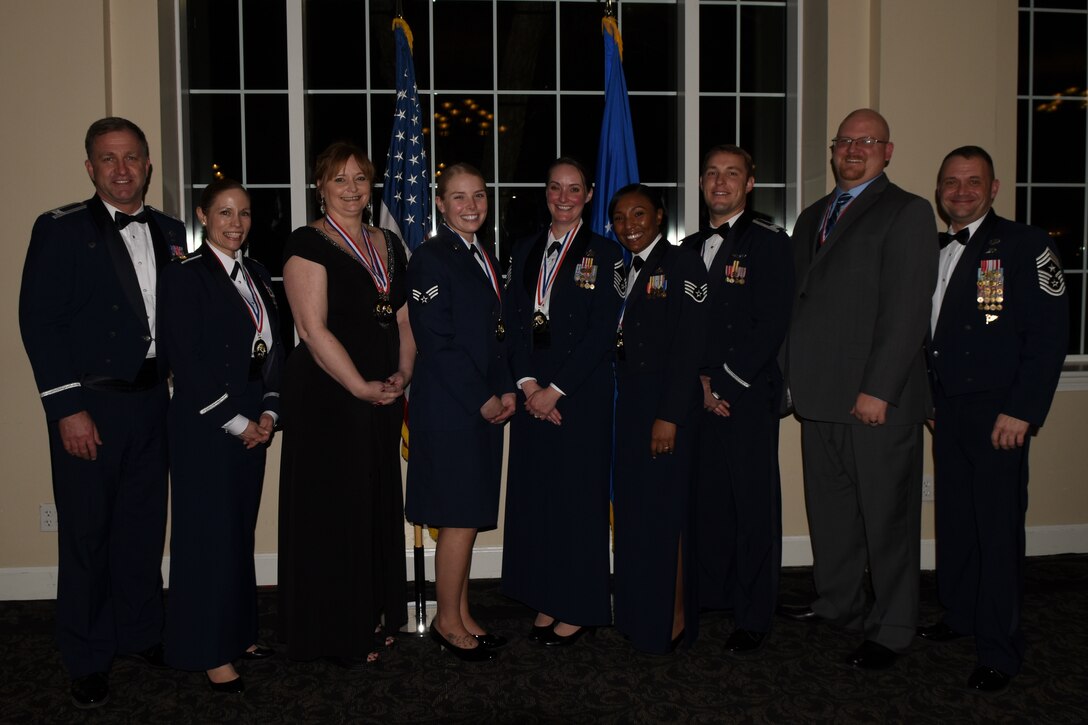 Col. Mark Slocum (left), 4th Fighter Wing commander, and Chief Master Sgt. Shane Wagner (far right), 4th FW command Chief, with 2015 Annual Award Winners.  