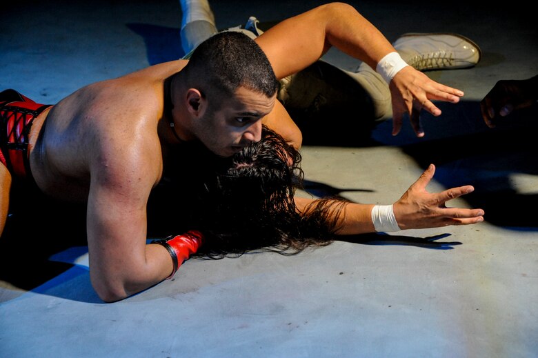 U.S. Air Force Senior Airman Majd Saif, 924th Aircraft Maintenance Squadron A-10C Thunderbolt crew chief, puts his opponent in a headlock during a wrestling match at the Crescent Ballroom in Phoenix, Ariz., Jan. 29, 2016. Saif’s objective is to entertain the audience by making the scripted combat look as real as possible. (U.S. Air Force photo by Airman Basic Nathan H. Barbour/Released)