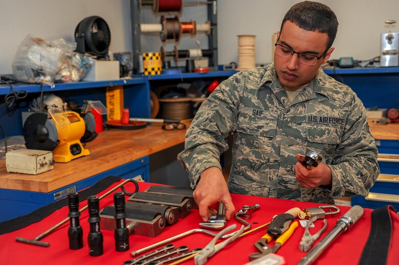 U.S. Air Force Senior Airman Majd Saif, 924th Aircraft Maintenance Squadron A-10C Thunderbolt crew chief, sorts tools at Davis-Monthan Air Force Base, Ariz., Jan. 27, 2016. Saif aids in the flightline mission by ensuring they have tools in serviceable condition and that all necessary equipment is available. Saif is a professional wrestler in his off time and adopts a persona in the ring that is much different from his normal appearance. (U.S. Air Force photo by Airman Basic Nathan H. Barbour/Released)