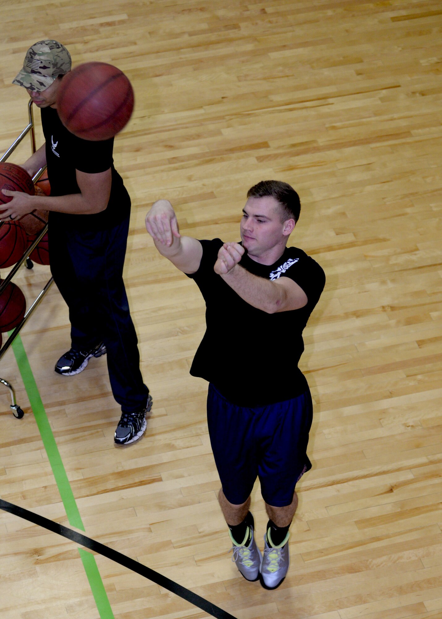 Senior Airman Brian Frazier, 28th Civil Engineer Squadron technician, shoots a jump shot during a 3-point competition in the Bellamy Fitness Center at Ellsworth Air Force Base, S.D., Jan. 28, 2016. The competition was a part of the 3-Day Basketball Extravaganza which included a free throw, 3-point and 4-on-4 challenge. The gym is open Monday to Friday from 5:30 a.m. to 8 p.m.; and Saturday to Sunday from 9 a.m. to 6 p.m.; for more information on events at the fitness center call (605) 385-2266. (U.S. Air Force photo by Airman Sadie Colbert/Released)