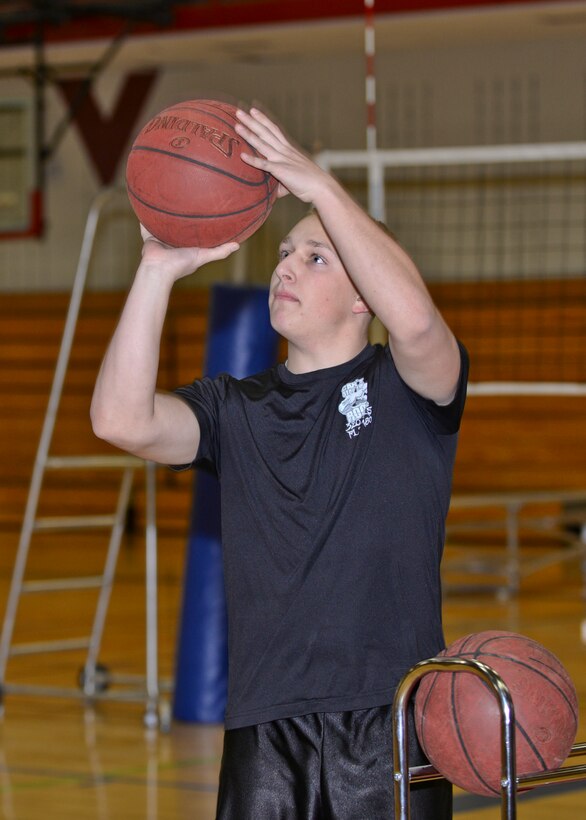 Airman 1st Class Anthony Greenwell, 28th Aircraft Maintenance Squadron commander support staff administrator, participates in a basketball free-throw competition inside the Bellamy Fitness Center at Ellsworth Air Force Base, S.D., Jan. 27, 2016. The three-day event consisted of a free throw, 3-point and 4-on-4 competition amongst Airmen and was organized to help bolster morale and encourage physical activity on-base. The gym is open Monday to Friday from 5:30 a.m. to 8 p.m.; and Saturday to Sunday from 9 a.m. to 6 p.m.; for more information on events at the fitness center call (605) 385-2266. (U.S. Air Force photo by Airman Sadie Colbert/Released)