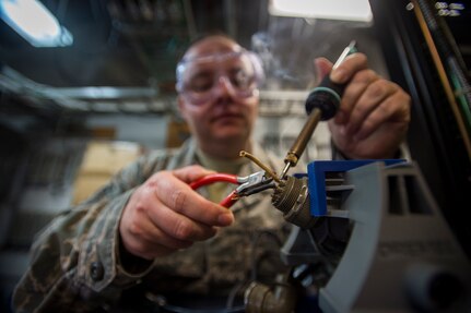 Tech. Sgt. Shawn Arnett, 437th Operations Support Squadron airfield systems technician, performs sautering techniques Jan. 27, 2016, at the command tower on Joint Base Charleston – North Auxiliary Air Field, S.C.