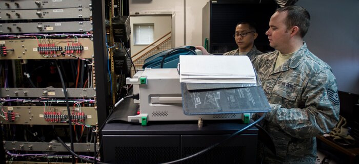 Tech. Sgt. Shawn Arnett, 437th Operations Support Squadron airfield systems technician, adjusts a radio’s frequency Jan. 27, 2016, at the command tower on Joint Base Charleston – North Auxiliary Air Field, S.C. This two-man team ensures that all of their airfield systems located at North Field work properly and provide any maintenece when needed. (U.S. Air Force photo/Senior airman Clayton Cupit)