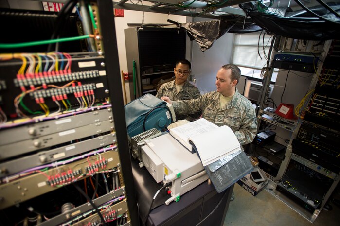 Tech. Sgt. Shawn Arnett, 437th Operations Support Squadron airfield systems technician, adjusts a radio’s frequency Jan. 27, 2016, at the command tower on Joint Base Charleston – North Auxiliary Air Field, S.C. This two-man team ensures that all of their airfield systems located at North Field work properly and provide any maintenece when needed. (U.S. Air Force photo/Senior airman Clayton Cupit)
