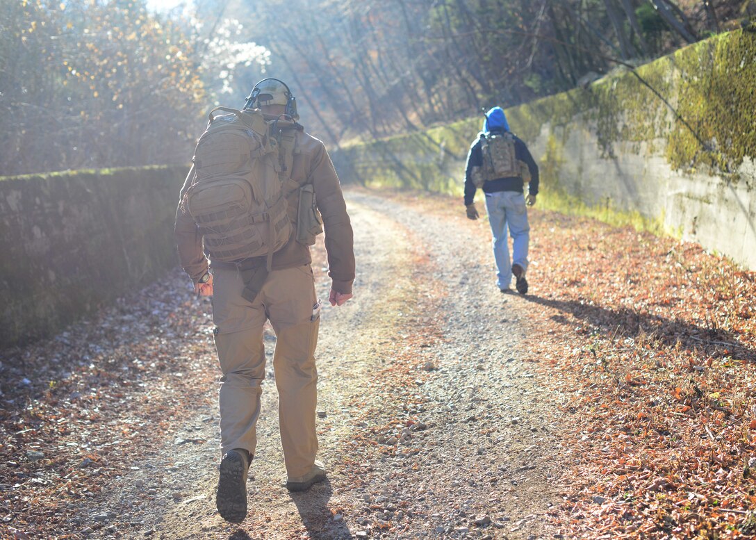 (From left) U.S. Air Force Senior Airman Tormod Lillekroken, 2nd Air Support Operations Squadron Tactical Air Control Party journeyman, and Tech. Sgt. Jason Basaldua, 2nd ASOS TACP instructor, hike during a training exercise Jan. 29, 2016 in Longarone, Italy. Pilots with the 555th Fighter Squadron and 2nd ASOS TACPs trained in surface-to-air threat scenarios in which they provided pilots with simulated enemy coordinates from austere locations. (U.S. Air Force photo by Staff Sgt. Evelyn Chavez/Released)