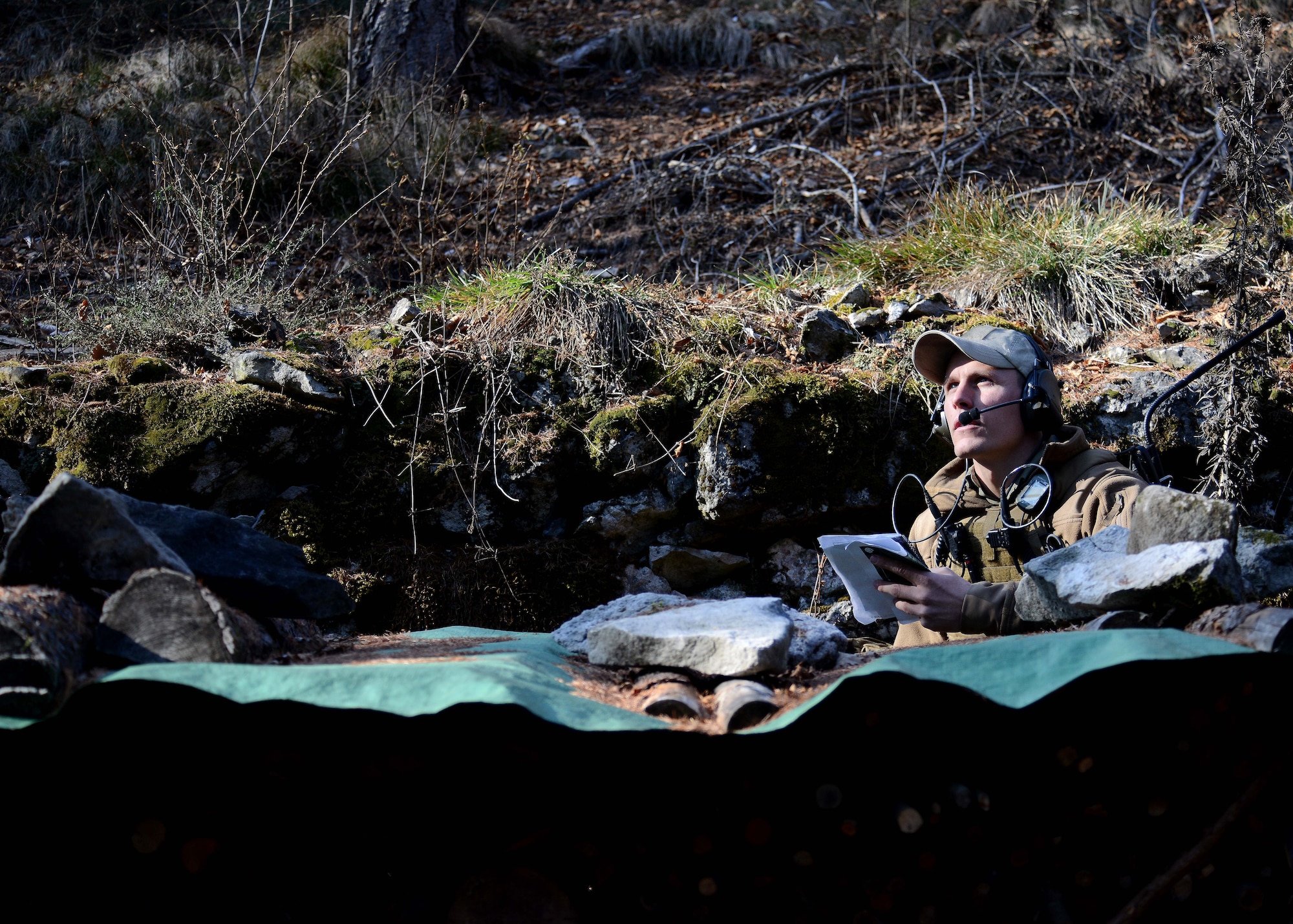 U.S. Air Force Senior Airman Tormod Lillekroken, 2nd Air Support Operations Squadron Tactical Air Control Party journeyman, waits on a mountain Jan. 29, 2016, in Longarone, Italy. Pilots with the 555th Fighter Squadron and 2nd ASOS TACPs trained in surface-to-air threat scenarios in which they provided pilots with simulated enemy coordinates from austere locations. (U.S. Air Force photo by Staff Sgt. Evelyn Chavez/Released)