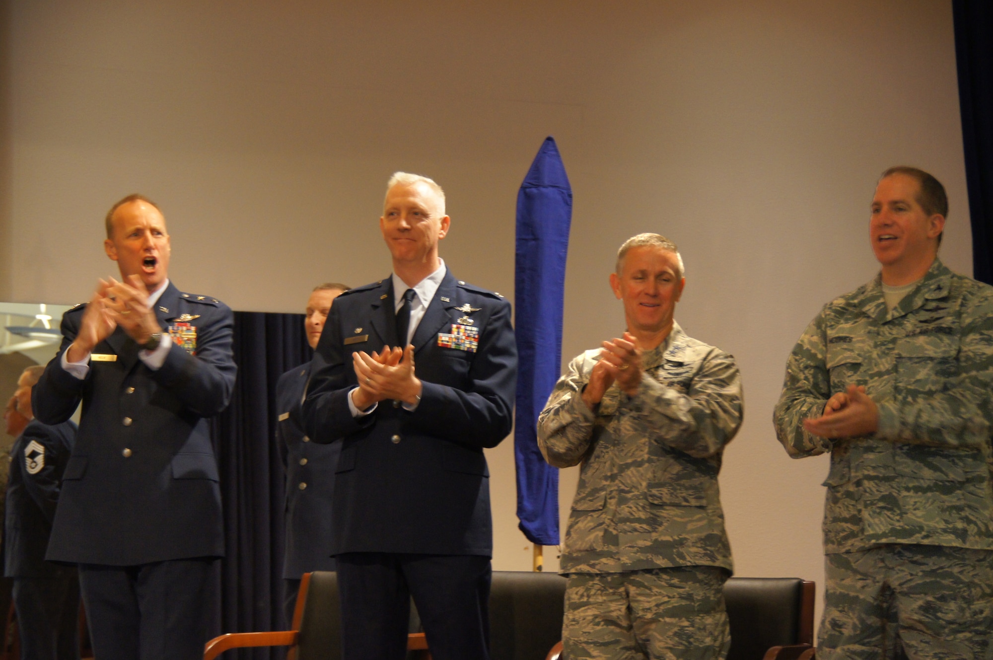 California Air National Guard Commander Maj. Gen. Jon Kelk, left, 195th Wing Commander Col. Rick Hern, Air National Guard Assistant to the Commander, Air Force Space Command Maj. Gen. Paul Maas and Chief of Space and Cyber Warfare Operations Division Col. Kelly Hughes applaud the activation of the 195th Wing during an activation ceremony for the wing at Beale Air Force Base, Calif., Nov. 7, 2015. (California National Guard photo by Spc. Sigmund Rakiec)