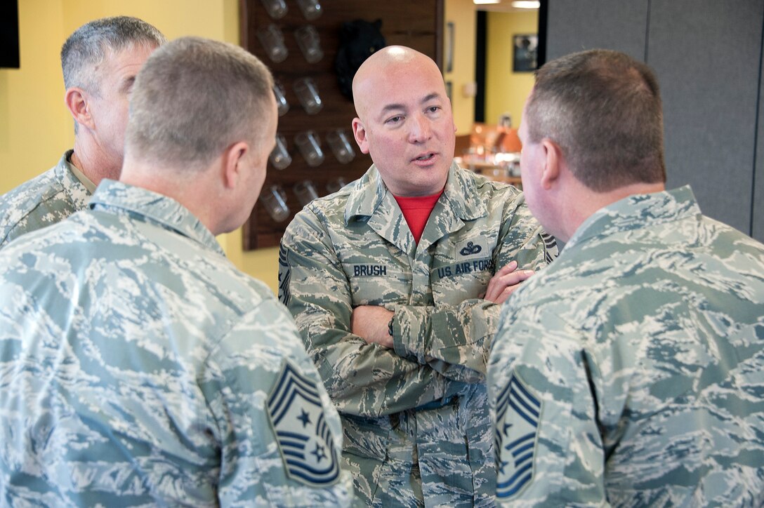 Command Chiefs of the Colorado Air National Guard discuss with U.S. Air Force Chief Master Sgt. Mitchell Brush, Senior Enlisted Advisor to the Chief National Guard Bureau, before he speaks at lunch to a hand selected group of enlisted members of the Colorado National Guard on Jan. 29, 2016, at the Panthers Den on Buckley Air Force Base, Colo. (U.S. Air National Guard photo by Capt. Benjamin Garland)