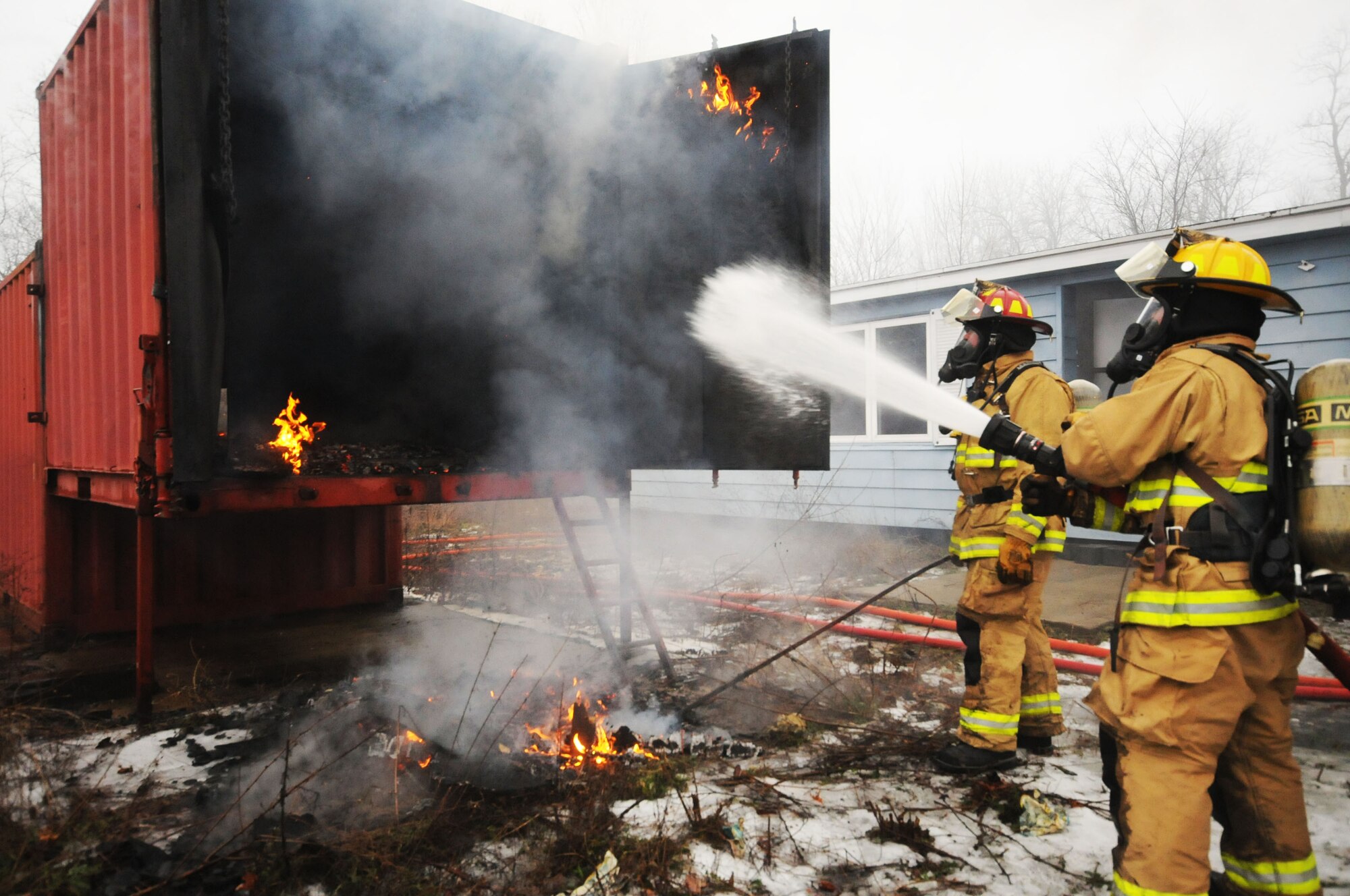 110th Attack Wing, Civil Engineering Squadron, Firefighters conduct Flashover training Saturday, January, 9, 2016, Thornapple Township Fire Station, Middleville, Mich.  In total fifteen firefighters participated in the flashover training, flashovers normally occur at 930 to 1100 degrees Fahrenheit, gases form at the ceiling of a structure, and suddenly ignite causing the entire ceiling to be on fire.  The 110th Fire Department is working closely with our local communities to increase hands on training and enrich our local partnerships.  (U.S. Air Force photo by Tech. Sgt. Timothy Diephouse/released)