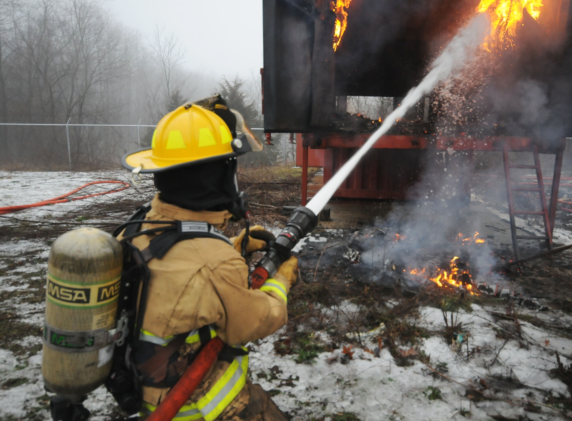 110th Attack Wing, Civil Engineering Squadron, Firefighters conduct Flashover training Saturday, January, 9, 2016, Thornapple Township Fire Station, Middleville, Mich.  In total fifteen firefighters participated in the flashover training, flashovers normally occur at 930 to 1100 degrees Fahrenheit, gases form at the ceiling of a structure, and suddenly ignite causing the entire ceiling to be on fire.  The 110th Fire Department is working closely with our local communities to increase hands on training and enrich our local partnerships.  (U.S. Air Force photo by Tech. Sgt. Timothy Diephouse/released)