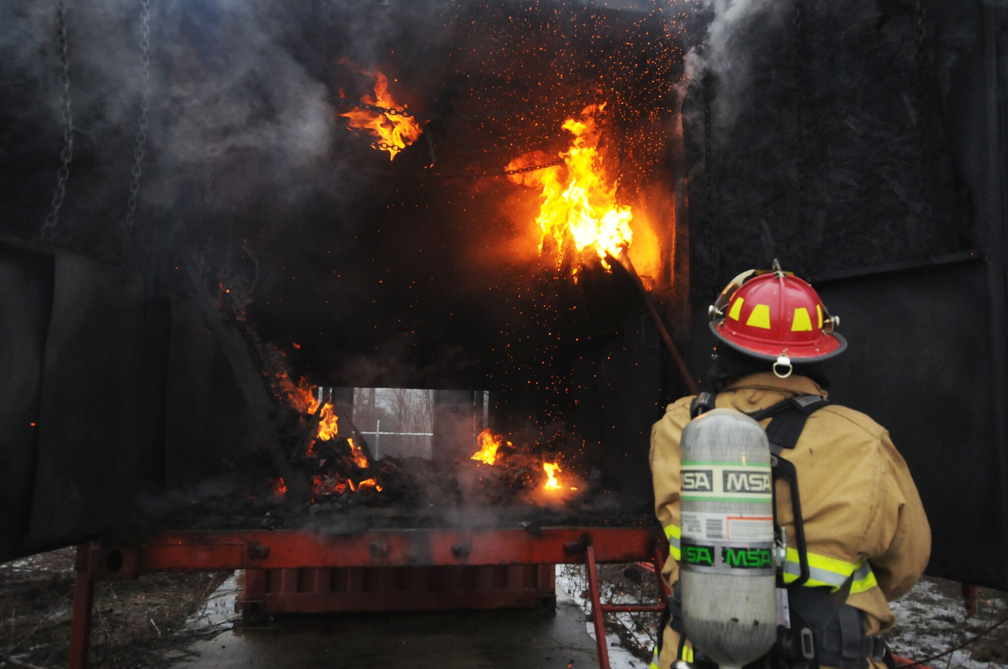110th Attack Wing, Civil Engineering Squadron, Firefighters conduct Flashover training Saturday, January, 9, 2016, Thornapple Township Fire Station, Middleville, Mich.  In total fifteen firefighters participated in the flashover training, flashovers normally occur at 930 to 1100 degrees Fahrenheit, gases form at the ceiling of a structure, and suddenly ignite causing the entire ceiling to be on fire.  The 110th Fire Department is working closely with our local communities to increase hands on training and enrich our local partnerships.  (U.S. Air Force photo by Tech. Sgt. Timothy Diephouse/released)