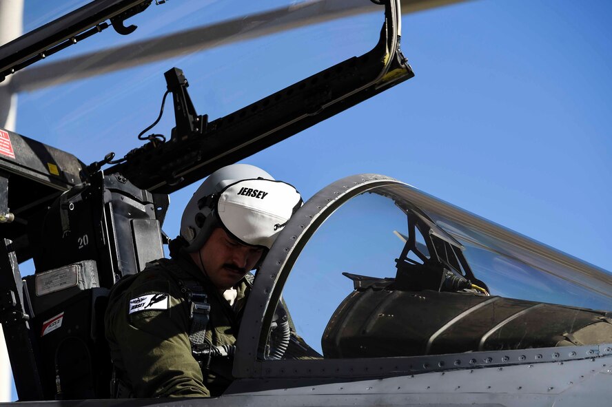 U.S. Air Force Maj. Jonathan Burd, 194th Fighter Squadron pilot, prepares for a combat training mission at the Nellis Air Force Base, Nev. flight line as part of Red Flag 16-1, Feb. 2, 2016. Red Flag is a realistic combat training exercise which involves air, space and cyber forces from the U.S. and its allies. (U.S. Air National Guard photo by Senior Airman Klynne Pearl Serrano)