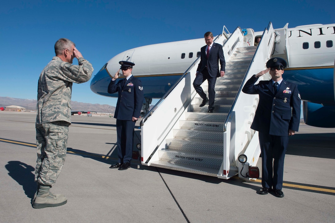 Air Force Maj. Gen. Jay B. Silveria, commander, U.S. Air Force Warfare Center, greets Defense Secretary Ash Carter as he arrives on Nellis Air Force Base, Nev., Feb. 4, 2016. Carter visited the base to tour facilities and discuss future budgets. DoD photo by Navy Petty Officer 1st Class Tim D. Godbee