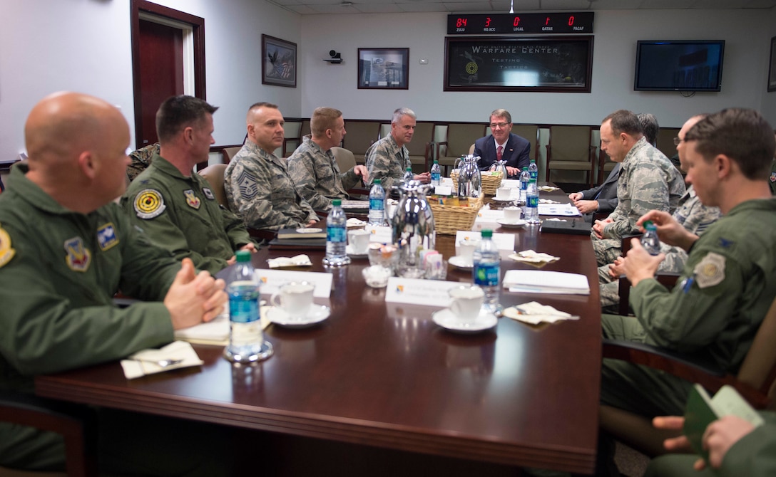 Defense Secretary Ash Carter, center back, receives a briefing on the operations of the Air Force Warfare Center at Nellis Air Force Base, Nev., Feb. 4, 2016. DoD photo by Navy Petty Officer 1st Class Tim D. Godbee
