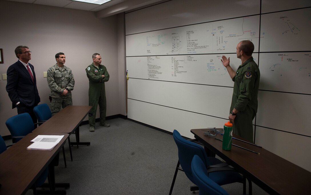 Defense Secretary Ash Carter, left, receives a briefing on the capabilities of the 66th Rescue Squadron on Nellis Air Force Base, Nev., Feb. 4, 2016. DoD photo by Navy Petty Officer 1st Class Tim D. Godbee