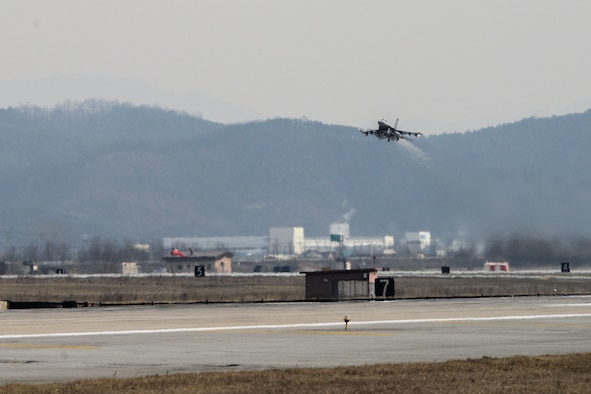 An F-16 Fighting Falcon takes off on the new runway at Osan Air Base, Republic of Korea, Jan. 22, 2016. The Army Corps of Engineers, 51st Civil Engineer and Operation Support Squadron completed the five-year project to construct the new runway in January 2016. (U.S. Air Force photo by Airman 1st Class Dillian Bamman/Released)