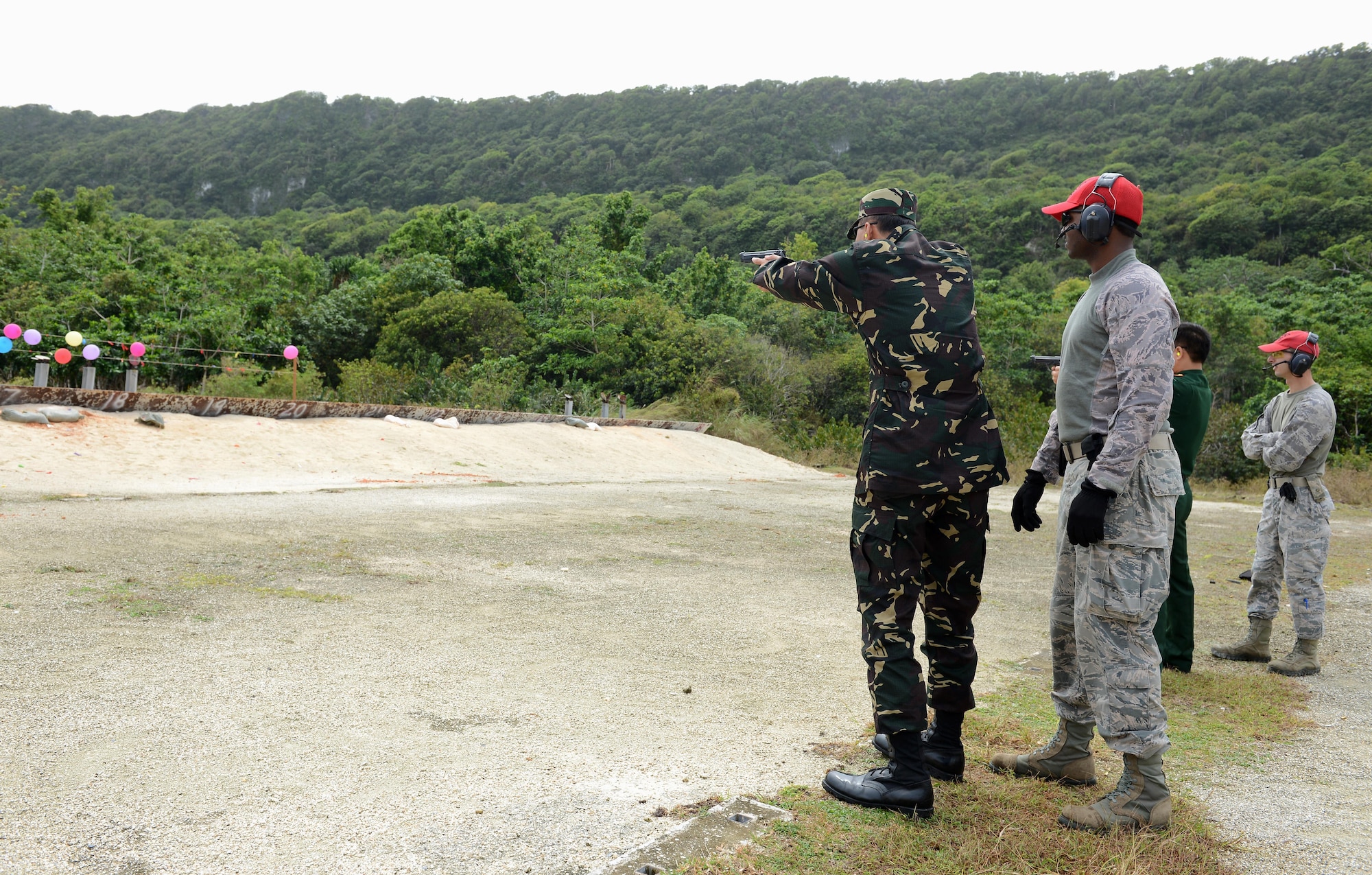 Pacific Defender Security Forces Subject Matter Expert Exchange attendees visit a Combat Arms Training Maintenance Site Feb. 3, 2016, at Andersen Air Force Base, Guam. Pacific Defender 16-1 is an international subject-matter expert exchange to help build partnerships across the Pacific region and promote interoperability. (U.S. Air Force photo/Airman 1st Class Arielle Vasquez)
