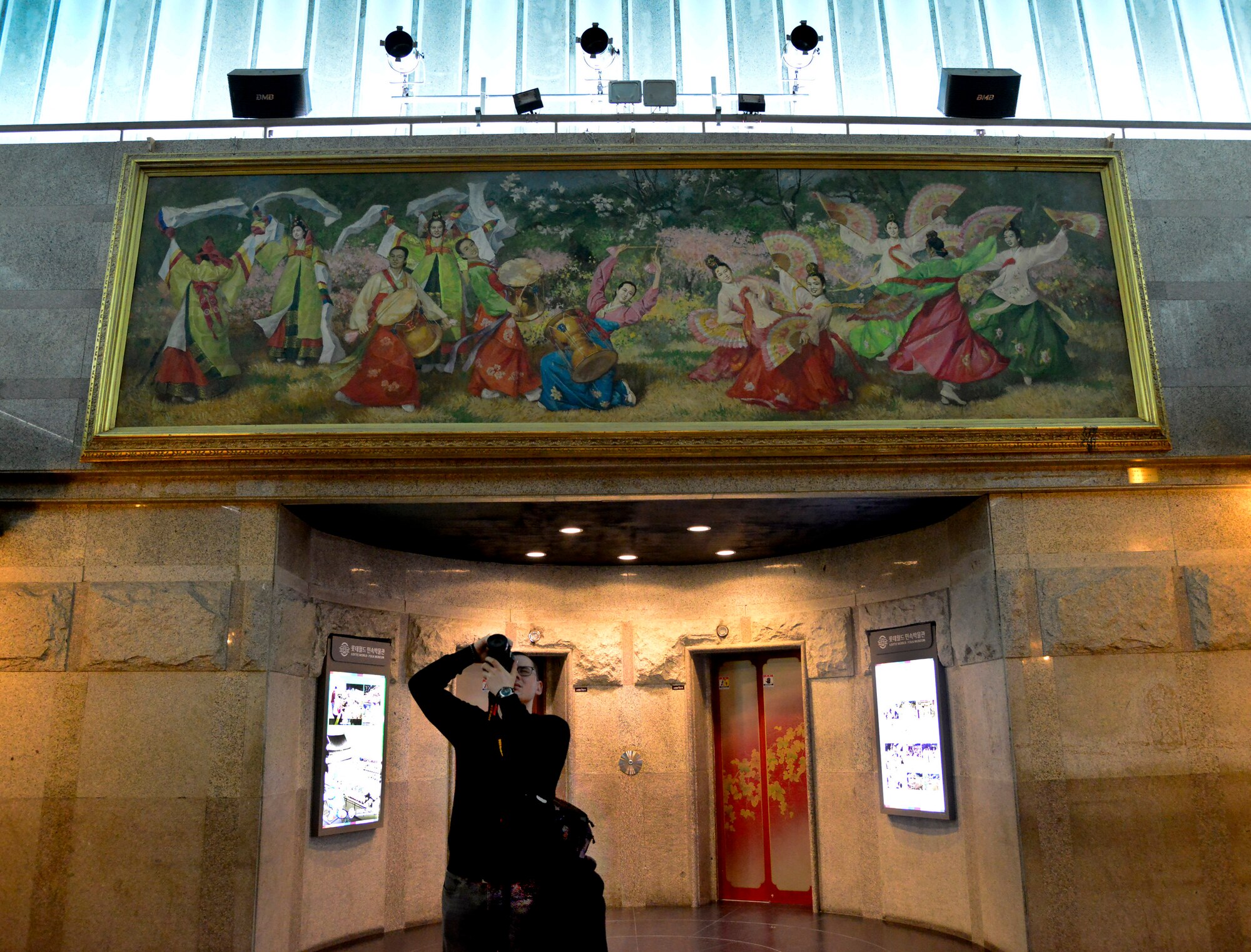 A sign points toward the entrance of a theme park and ice rink in the Lotte World Mall, Feb. 2, 2016. The mall features hundreds on stores and restaurants and is centrally located at Jamsil Station in Seoul. (U.S. Air Force photo by Senior Airman Kristin High/Released)