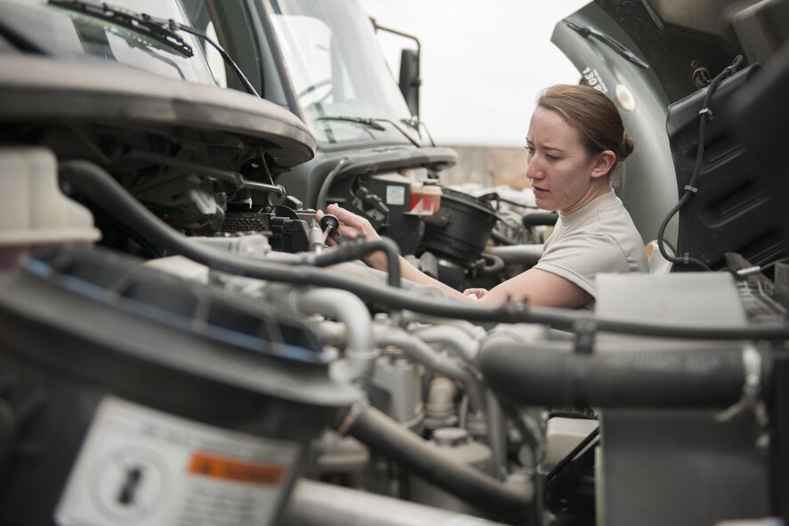 Senior Airman Rebecca Delay, a 421st Expeditionary Aircraft Maintenance Squadron Support Section support technician, checks fluid levels on a deicing vehicle at Bagram Airfield, Afghanistan, Jan. 29, 2016. The support section accounts for equipment, stores hazardous materials, maintains and inspects vehicles and ensures tools are in working condition for optimal maintenance production. (U.S. Air Force photo/Tech. Sgt. Robert Cloys)