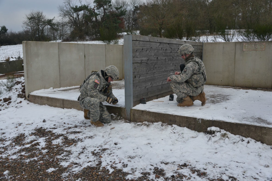 Soldiers connect detonation wires while participating in basic and advanced explosive ordnance training at Baumholder Military Training Area, Germany, Jan. 21, 2016. Army photo by Erich Backes