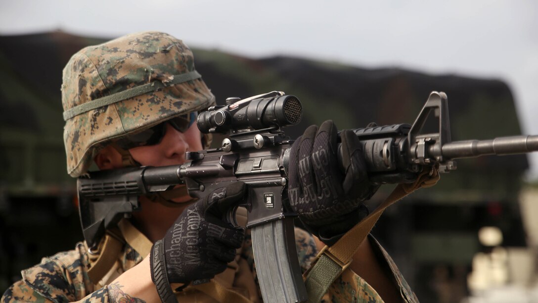 Cpl. Devin K. Maddox-White, a fire team leader and motor vehicle operator with 2nd Transportation Support Battalion, aims his M4 Carbine service rifle at notional enemies during a tactical operations package with Battle Skills Training School, 2nd Marine Logistics Group, at Marine Corps Base Camp Lejeune, N.C., Feb. 3, 2016. The course is conducted to refresh Marines from non-infantry military occupational specialties on infantry-related skills and tactics in a five-week span. 