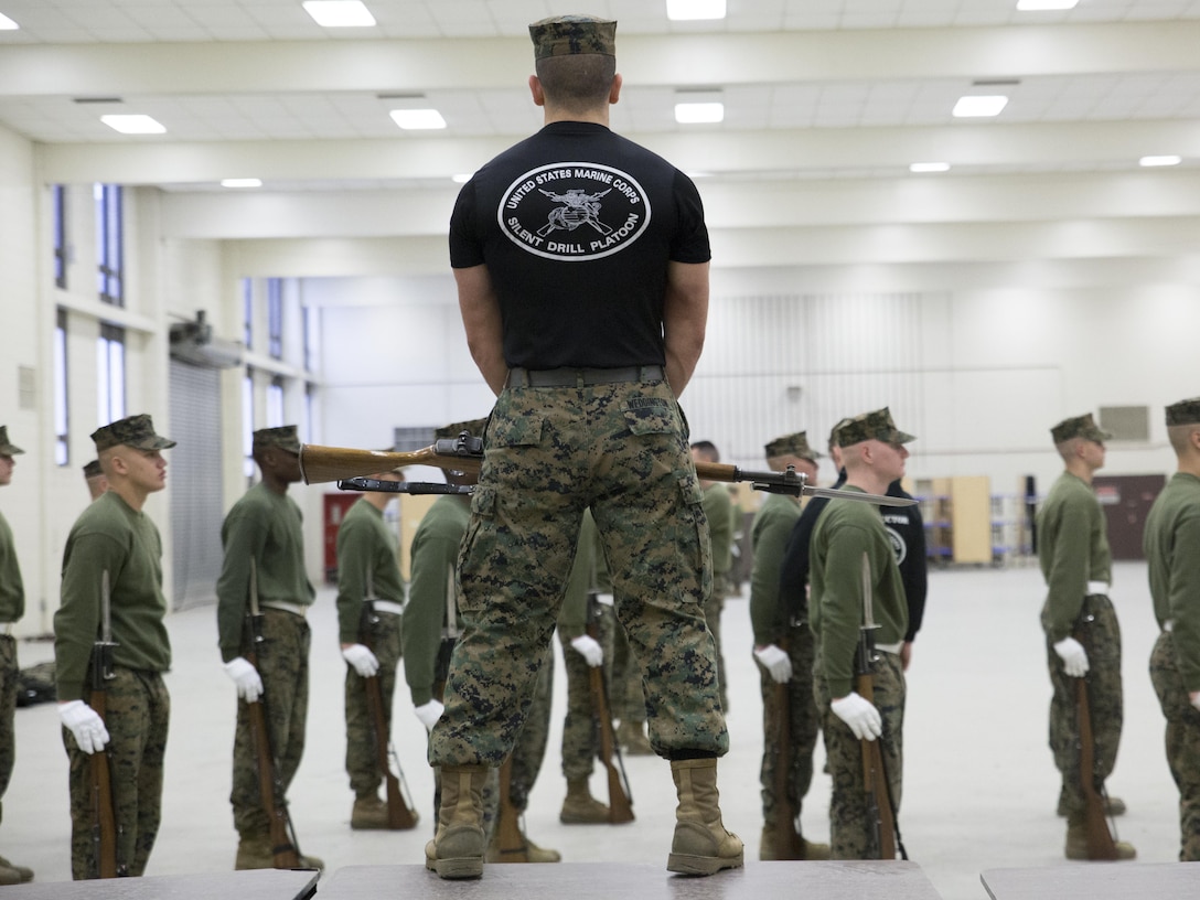 Lance Cpl. Christopher W. Weddington, assistant drill master trains students at the Silent Drill School on Joint Base Anacostia, Washington, D.C., Jan. 8, 2016. Each year from November to March the Silent Drill Platoon conducts Silent Drill School to hand-select new Marines for the upcoming parade season.  The selection process is conducted by Marines from previous years to identify Marines who will represent, on the parade deck, the professionalism associated with the Marine Corps. (Official Marine Corps photos by Cpl. Chi Nguyen/Released)
